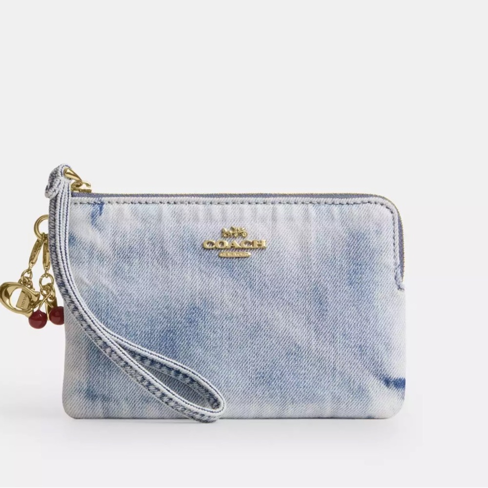 Coach Light Blue Denim Wristlet with Gold Hardware and Red Charm Details